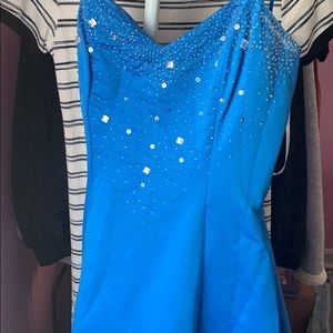 blue long evening dress with cross back.